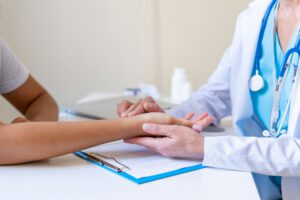 Doctor checking patient pulse. Measuring heartbeats. Health check. Appointment with specialist