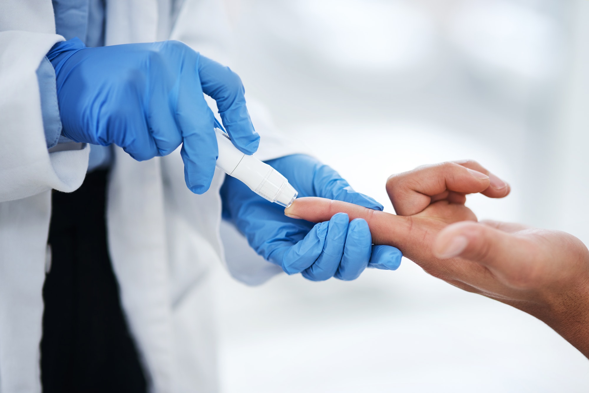 shot-of-an-unrecognisable-doctor-using-a-blood-sugar-test-on-his-patients-finger.jpg